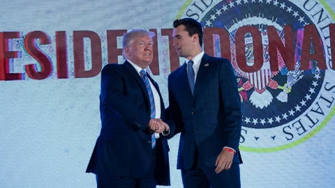 Donald Trump junto a Charlie Kirk | Foto: AFP