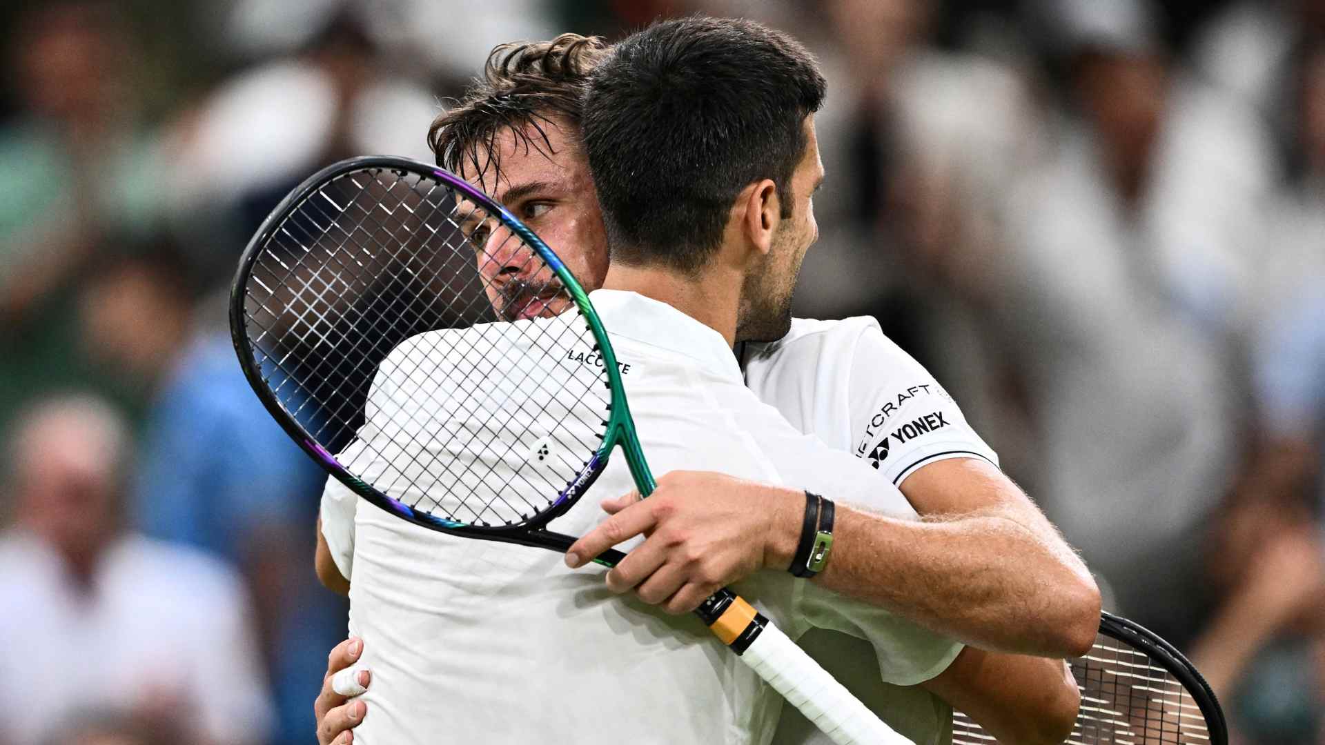 Stan Wawrinka y Novak Djokovic - AFP
