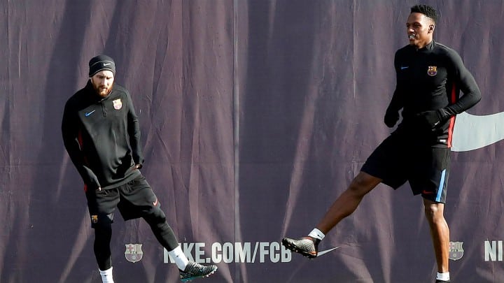 Yerry Mina y Lionel Messi